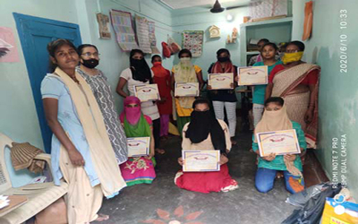 Distribution of sewing certificates  at Digha center